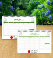 ปฏิทินนักวางแผนแบบตั้งโต๊ะ   ขนาดปฏิทิน :   8.25” x  5.5” เนื้อปฏิทินกระดาษปอนด์ 100 แกรม พิมพ์ออฟเซ็ท 2 สี 2 ด้าน จำนวน 34 แผ่น 68 หน้า -ปกหน้า 1 แผ่น 2 หน้า -ปฏิทินรายสัปดาห์  53 หน้า + กระดาษโน็ต 11 หน้า -ปกหลัง 1 แผ่น 2 หน้า ปฏิทินรวม 12 เดือนของปีถัดไป ขาตั้งกระดาษจั่วปังหุ้มกระดาษปอนด์ 100 แกรมสีขาว เจาะรูร้อยห่วงลวดคู่ยาวตลอดแนว
