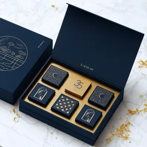 Premium rigid box, paper-wrapped, 4-color print, matte/gloss lamination, gold foil.